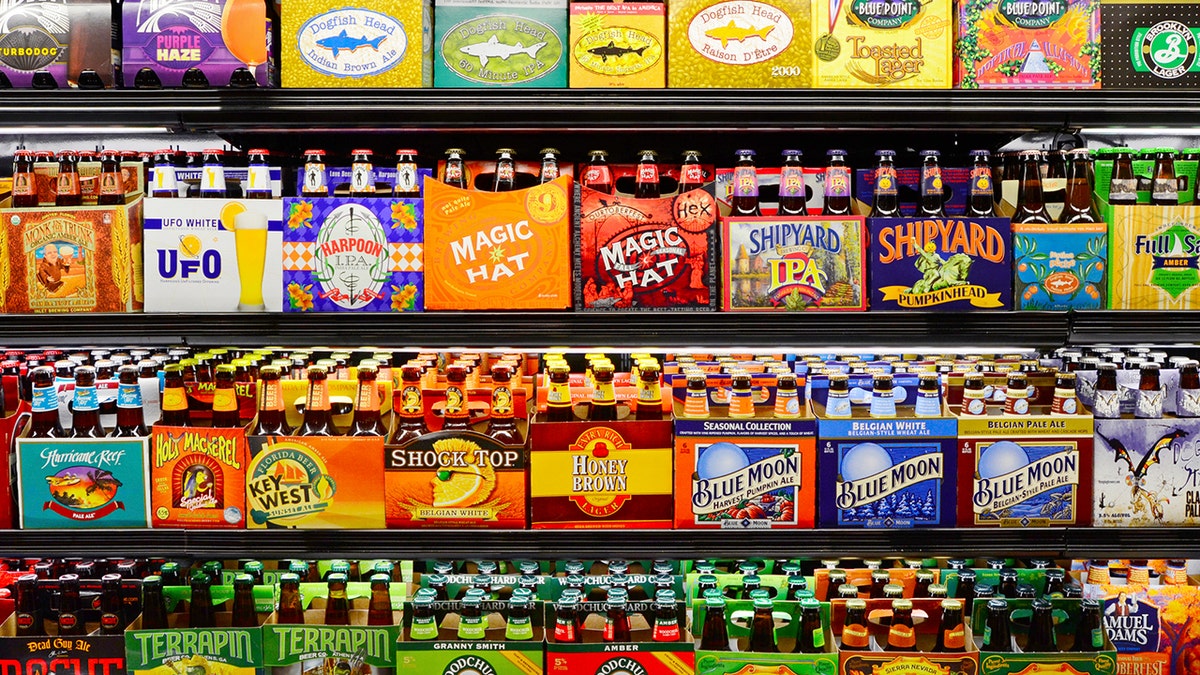 Rows of beers lined up on store shelves