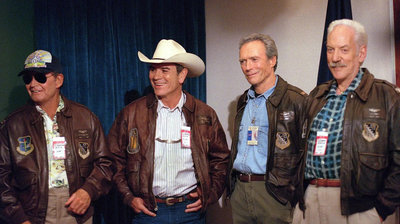 The main cast of Space Cowboys standing together in flight jackets