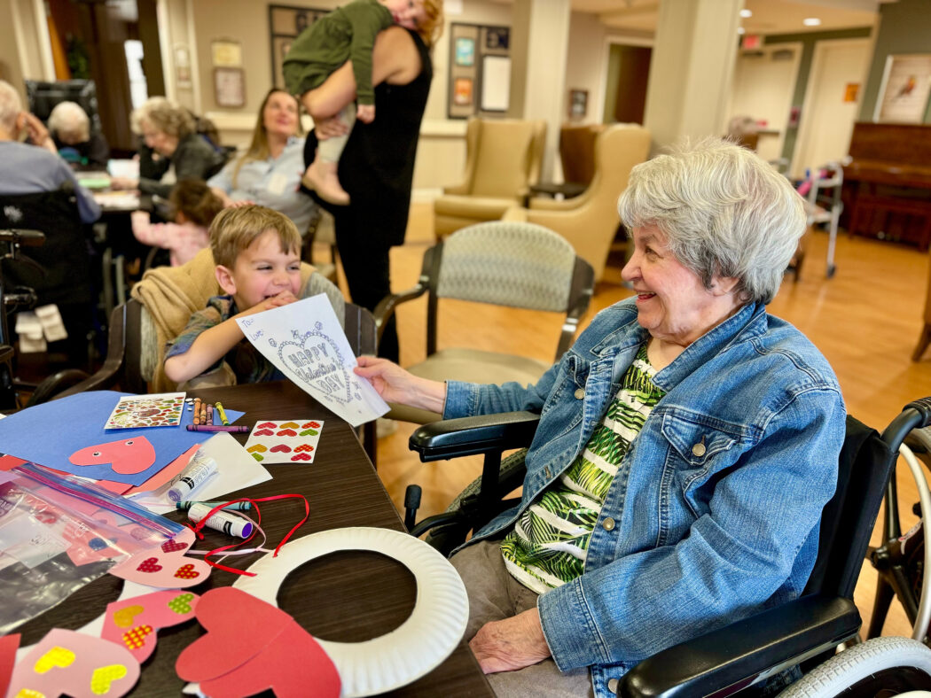 Resident of Juliette Fowler admires a child