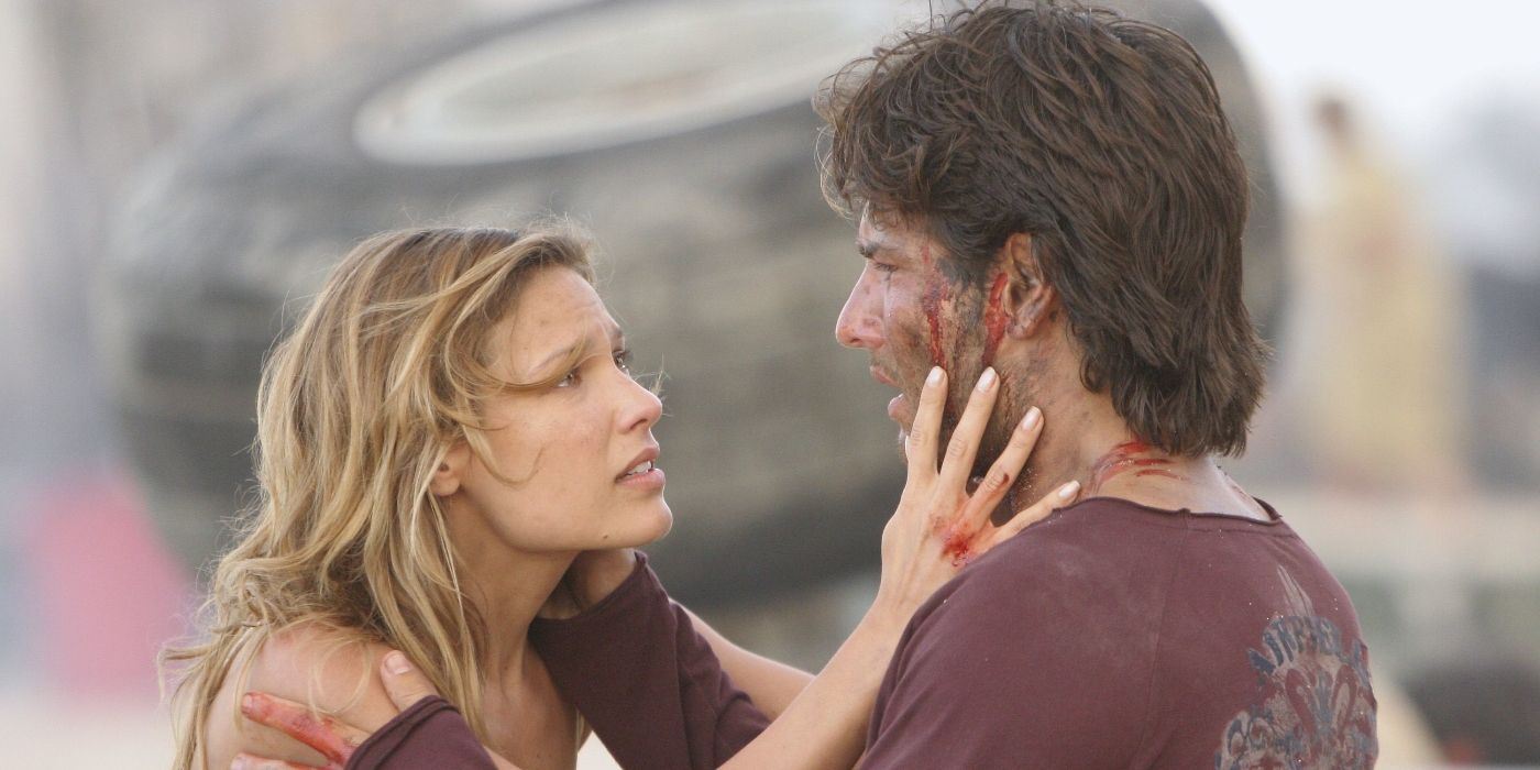 Kiele Sanchez touching Rodrigo Santoro's face after a plane crash on the beach in Lost Season 3.