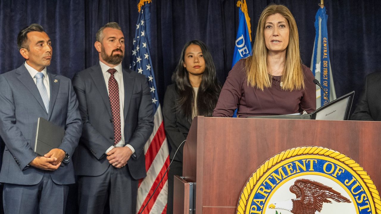 DEA Administrator Anne Milgram, at podium, joins U.S. Attorney Martin Estrada, far left, to announce five people have been charged in connection with Matthew Perry's death at a news conference in Los Angeles on Thursday, Aug. 15, 2024. (AP Photo/Damian Dovarganes)