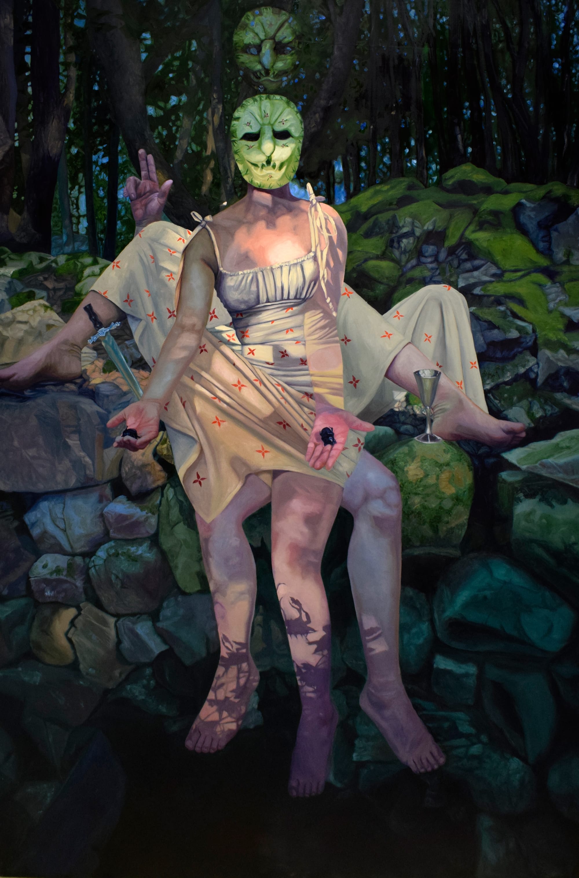 a painting of a figure wiht a knife and green mask in a forest at night with a ghostly figure behind her
