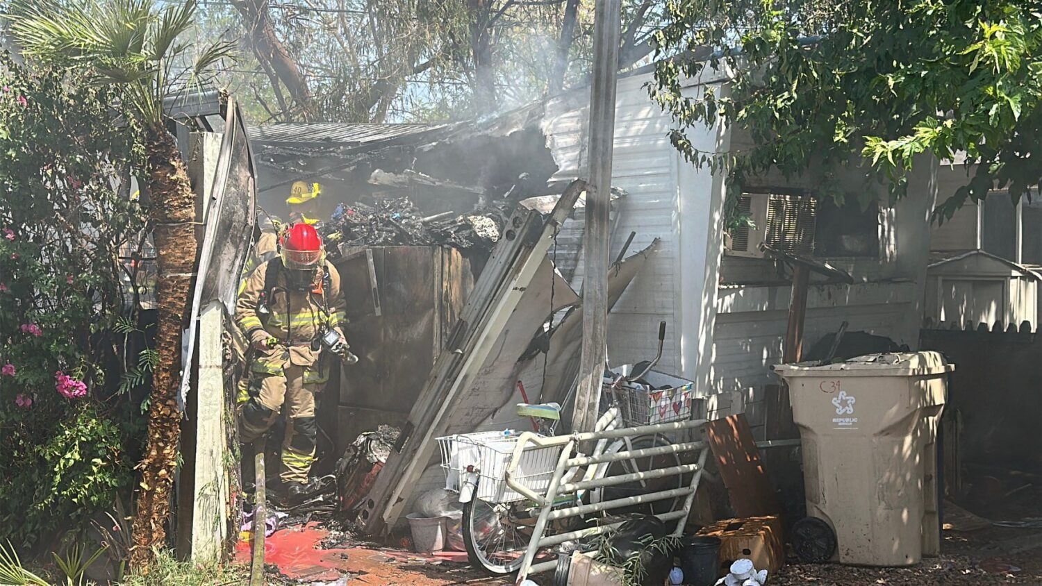 mobile home fire Phoenix man critical condition two dogs dead...