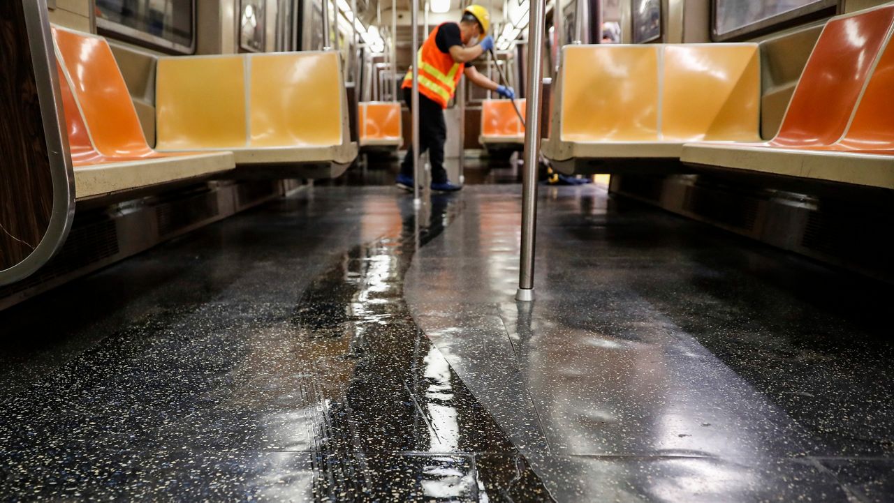 More than 450 employees will receive back pay, according to the comptroller’s office. (AP Photo/John Minchillo, File)