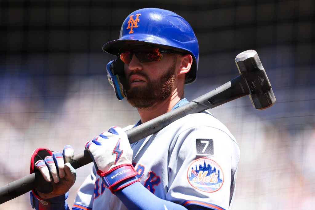 New York Mets player Brandon Nimmo with a sledgehammer.