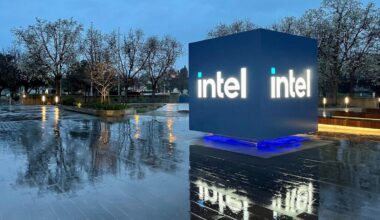 Intel Headquarters Robert Noyce Building in Santa Clara, California at night with Intel sign lit up.