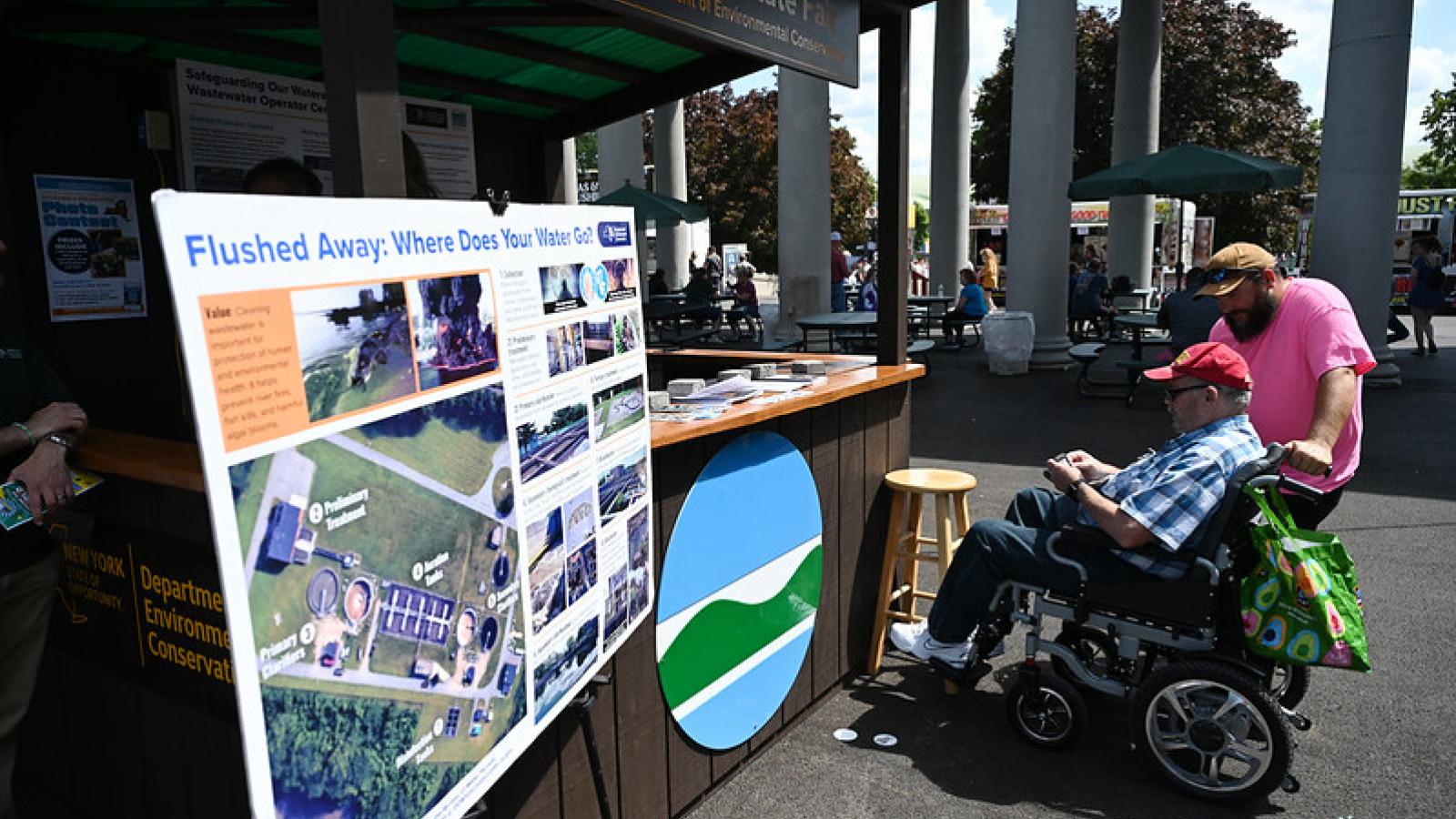NYS fair attendee at the DEC trailer booth for the NYS fair