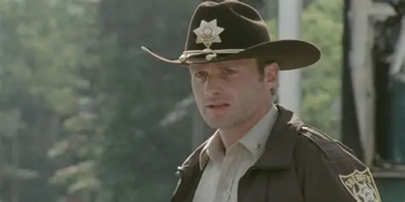 Rick Grimes looks at a zombie girl
