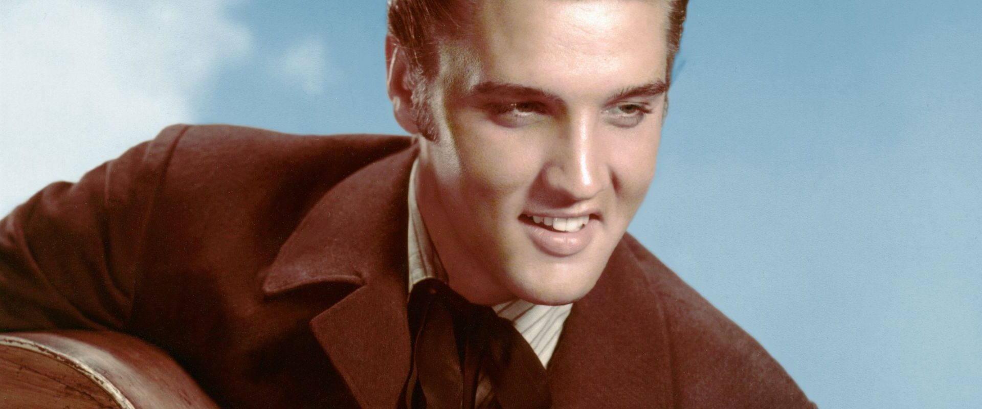 Elvis Presley posing for photo