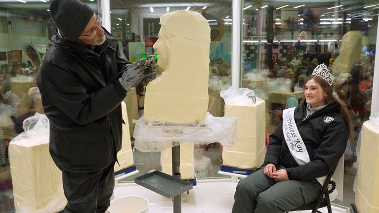 Sculptor Gerry Kulzer carves the likeness of Malorie Thorson, this year's Princess Kay of the Milky Way, out of a block of butter at the Minnesota State Fair, Thursday, Aug. 21, 2025 in Falcon Heights, Minn