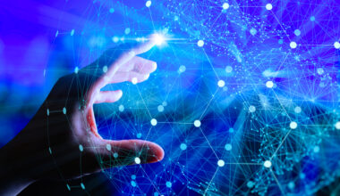 Impression of technology graphic with hand touching point in field.