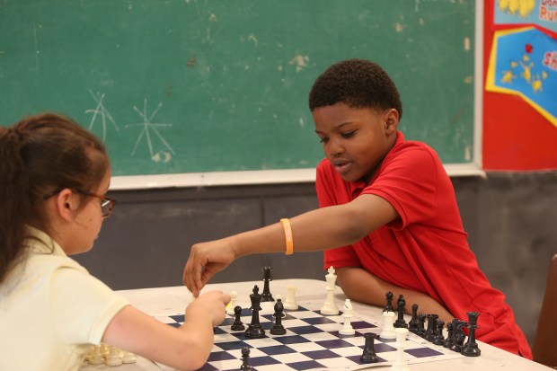 Kids take part in an afterschool chess program for Bed-Stuy elementary school students on May 26, 2017, in Brooklyn, New York. (Shutterstock)
