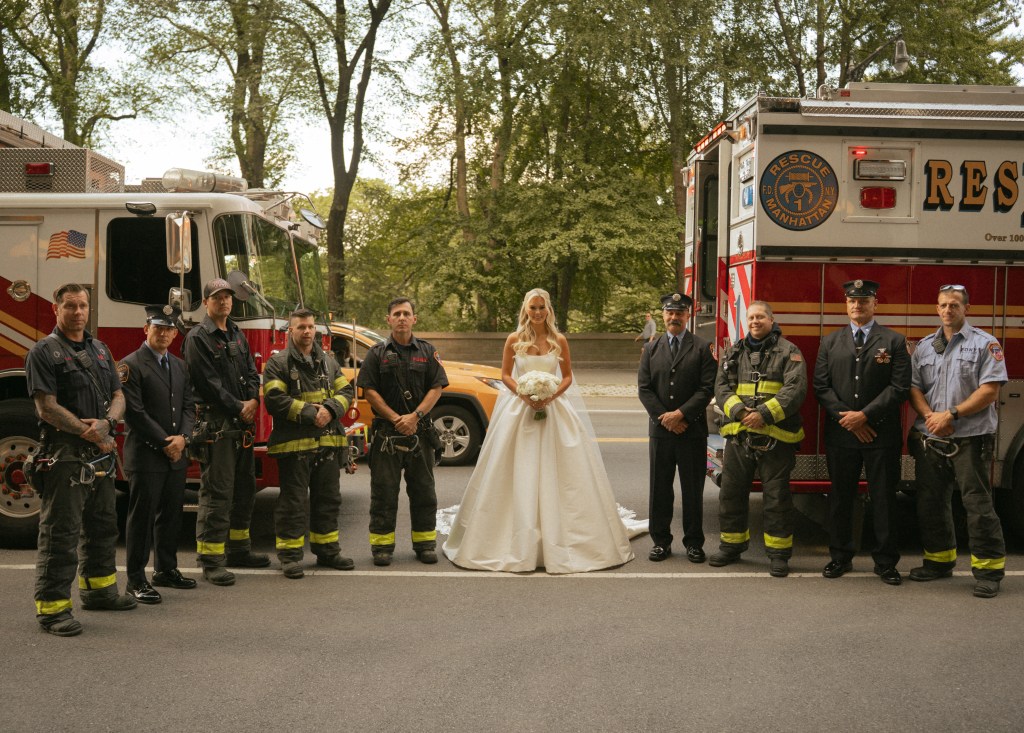 Kristin Marino posing with FDNY firefighters