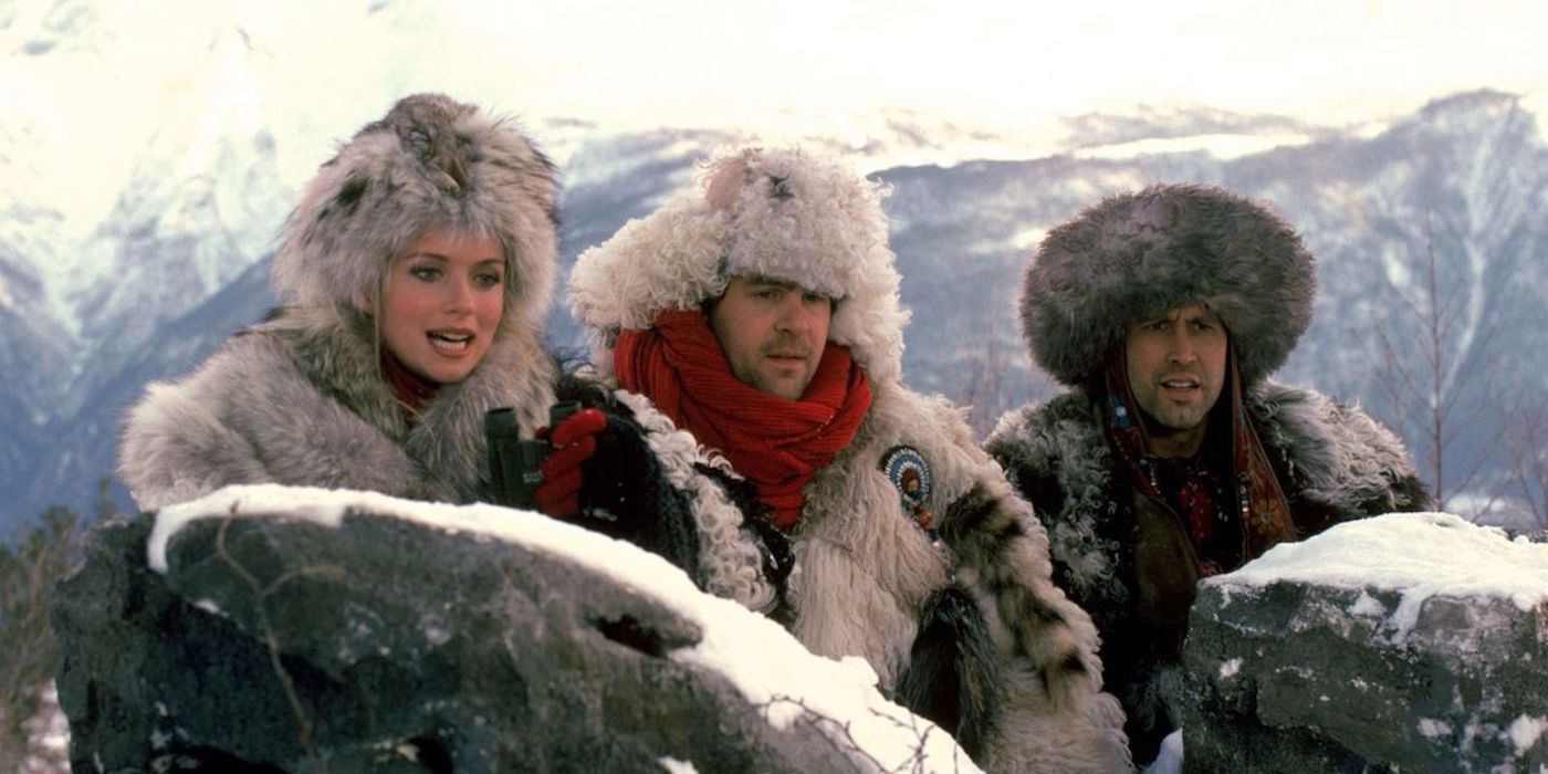 Three people in heavy furs on the snow in spies-like-us