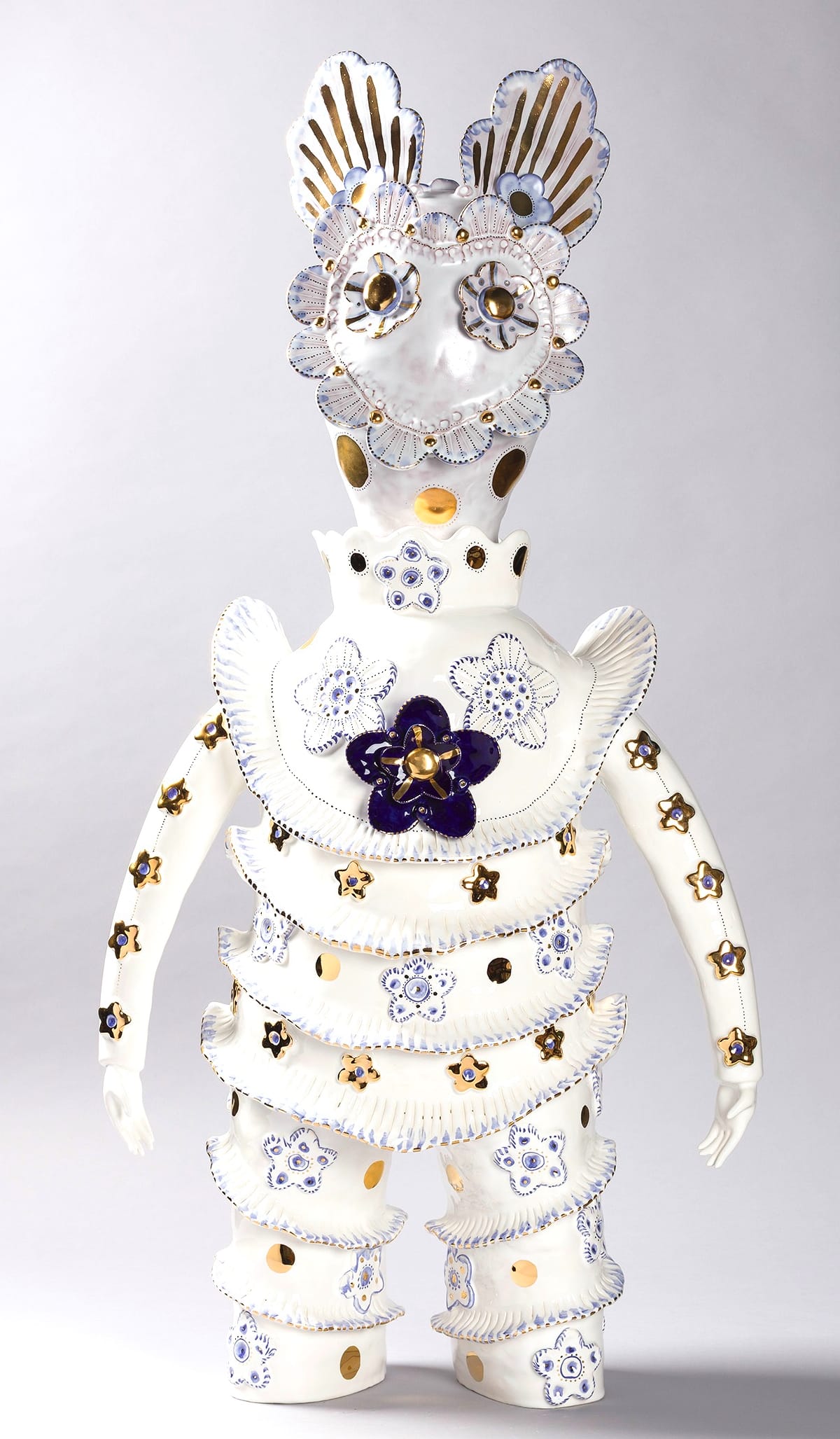 a white figure with patterns on its body