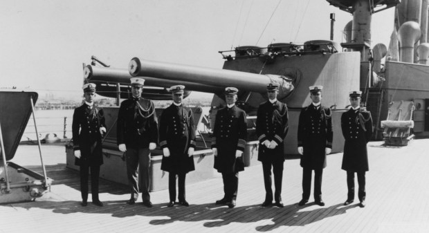 Admiral William B. Caperton, USN, Commander-in-Chief, U.S. Pacific Fleet (center) with members of his staff on board USS San Diego in San Diego in 1916. The ship was previously named USS California (CA-6.) (Courtesy of Naval History and Heritage Command).