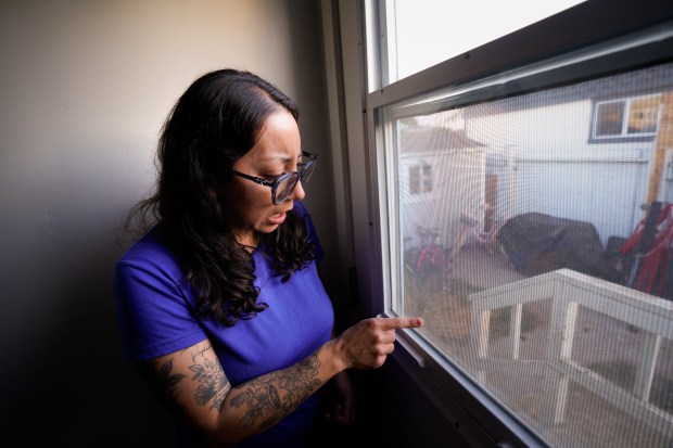 Martha Navarro recalls when she first saw the flood by watching remotely on her security camera and noticed her puppy nearly drowning on the back porch of her home on Beta Street in Southcrest in January 2024. (Nelvin C. Cepeda / The San Diego Union-Tribune)