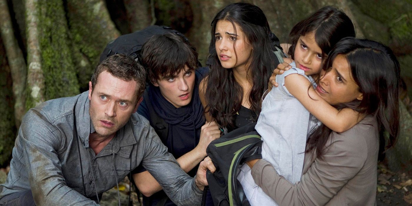 The Shannon family huddled together in the forest in Terra Nova