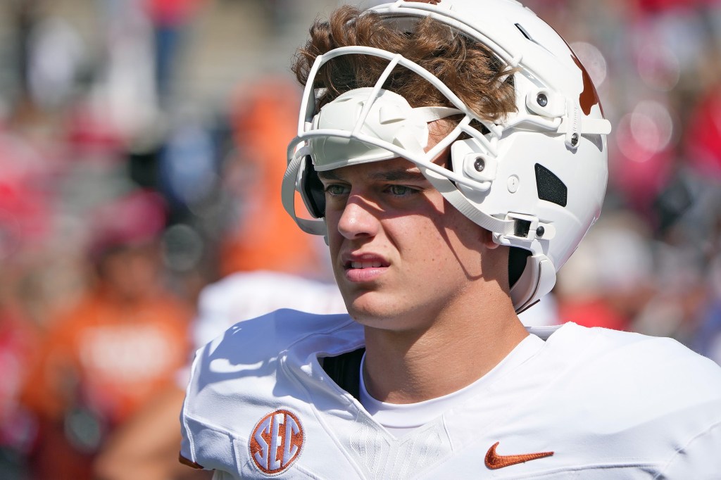 Arch Manning, Texas Longhorns quarterback, in a white jersey and helmet.