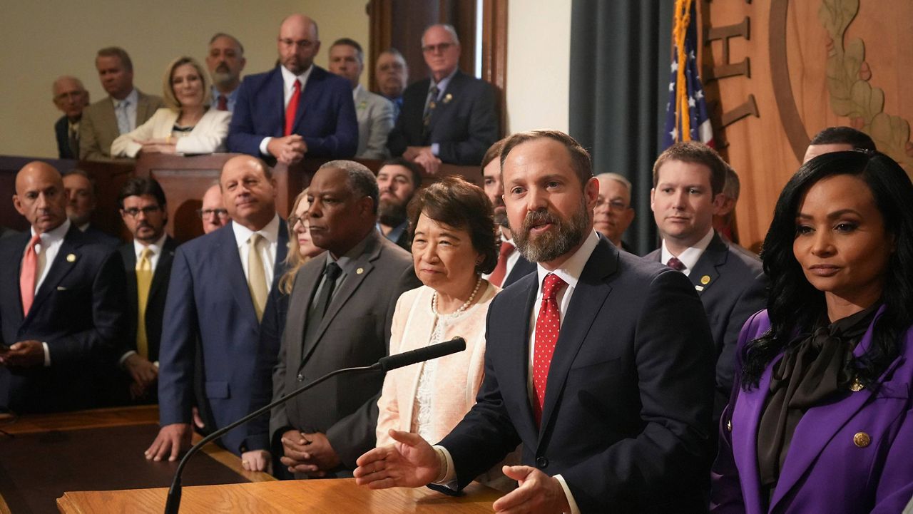 Speaker of the House Dustin Burrows speaks at a news conference at the Capitol in Austin, Texas, Monday, Aug. 4, 2025, after the Republican-dominated House was unable to establish the quorum of lawmakers required to do business. (Jay Janner/Austin American-Statesman via AP)