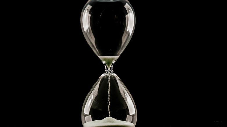 Image of an hourglass on a black background