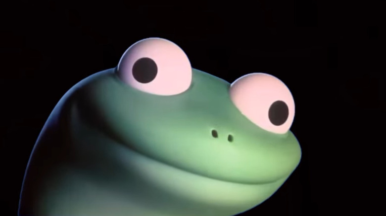 Tom the lizard's eyes look in two different directions as he has a big smile on his green face in "Hoppers"