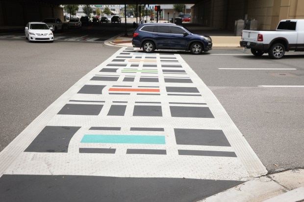The painted crosswalk at Amelia and N. Hughey Ave in...