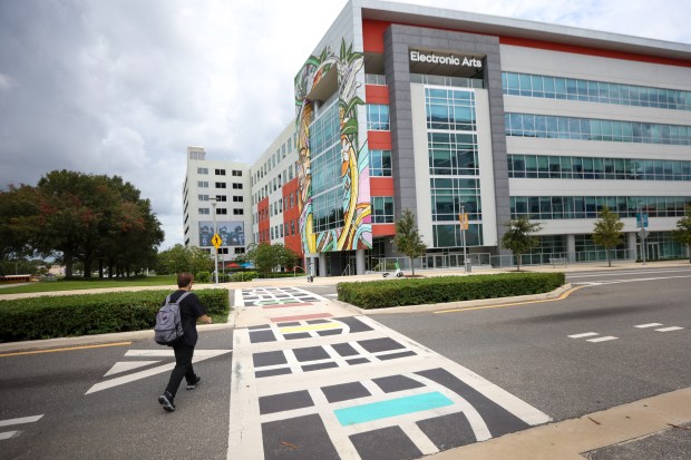 The painted crosswalk at Amelia St. and Putnam Ave leads...