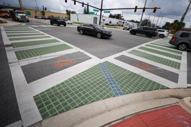 The painted crosswalk at W. Kaley Ave at S. Division...