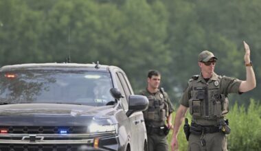 Woman killed by neighbor before responding state troopers were ambushed by gunfire, police say