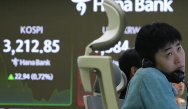 Asian shares charge higher after US stocks rally to records