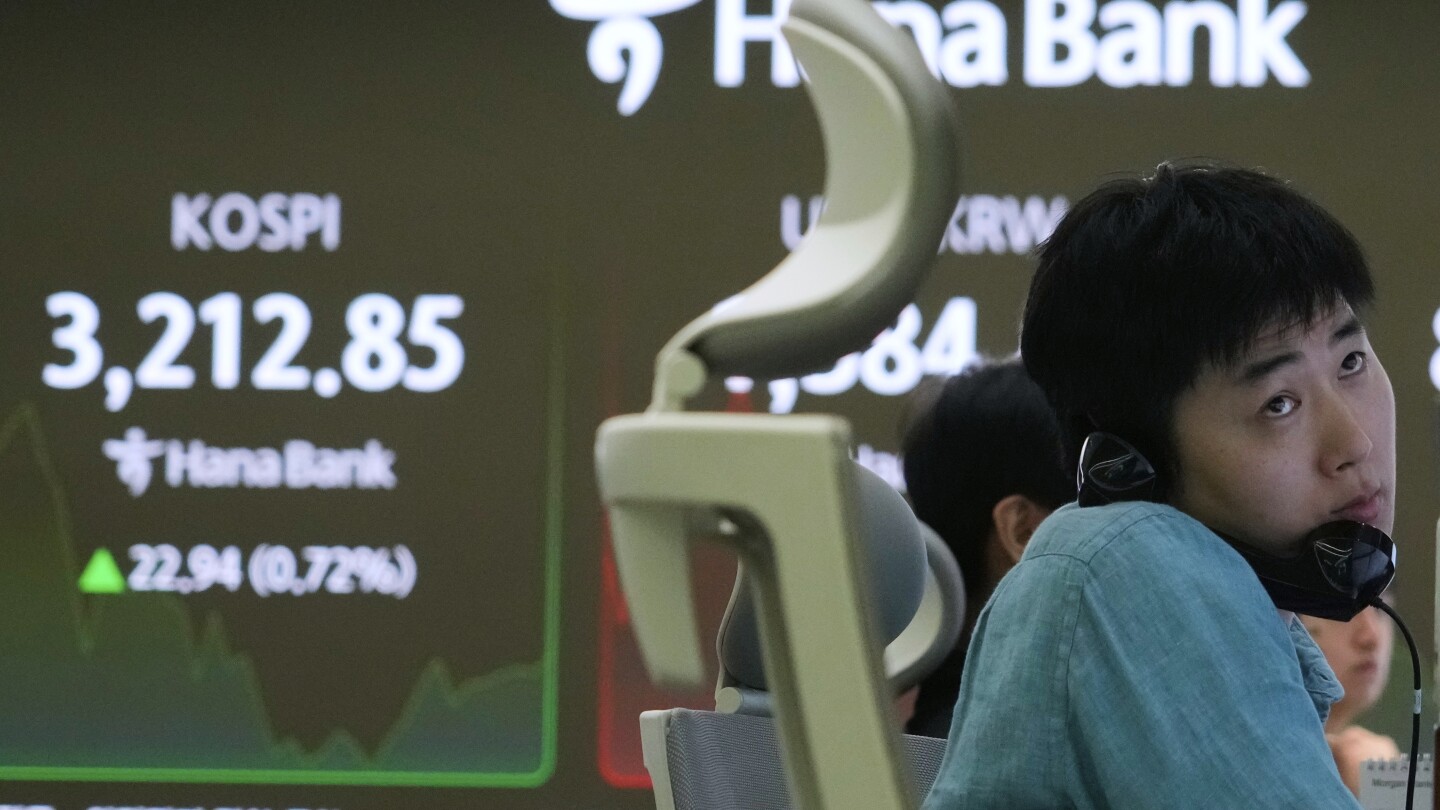 Asian shares charge higher after US stocks rally to records