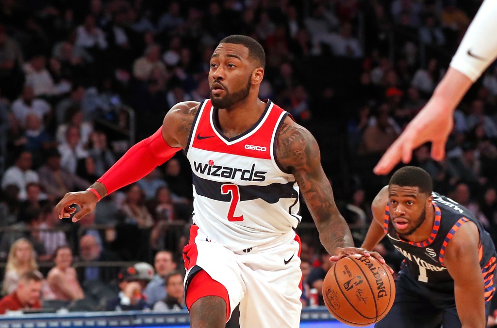 Washington Wizards guard John Wall drives to the basket against the Knicks.