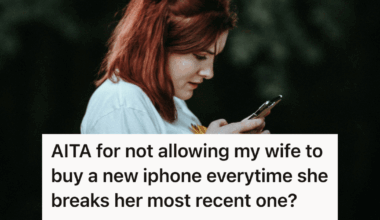 woman looking down at her phone