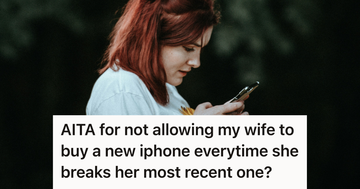 woman looking down at her phone