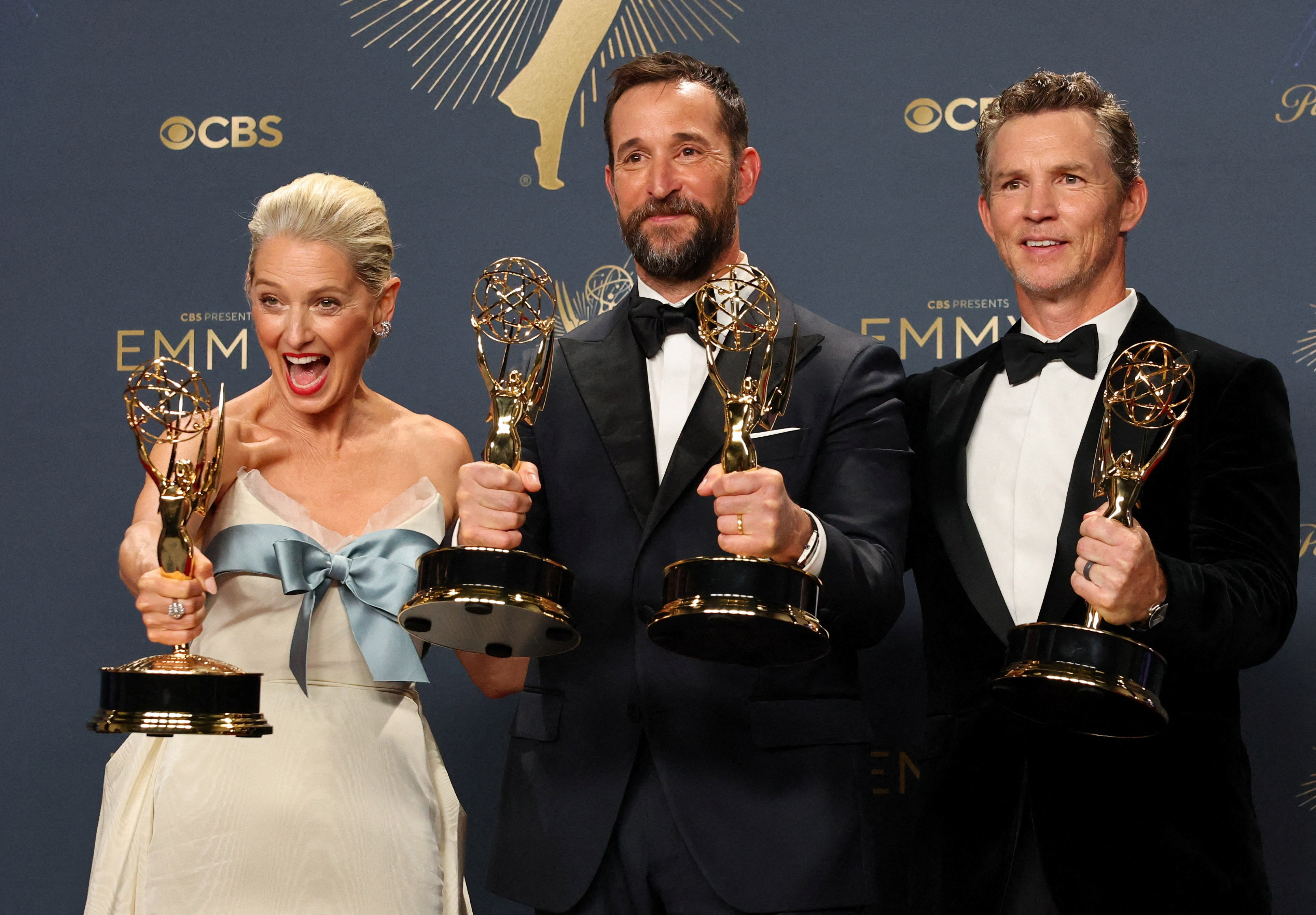 Katherine LaNasa, Noah Wyle, and Shawn Hatosy holding Emmy Awards.