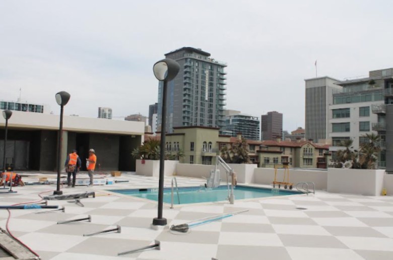 The fifth floor skydeck at Courtyard by Marriott San Diego/Little Italy contains a pool, fitness center and
restrooms under construction.