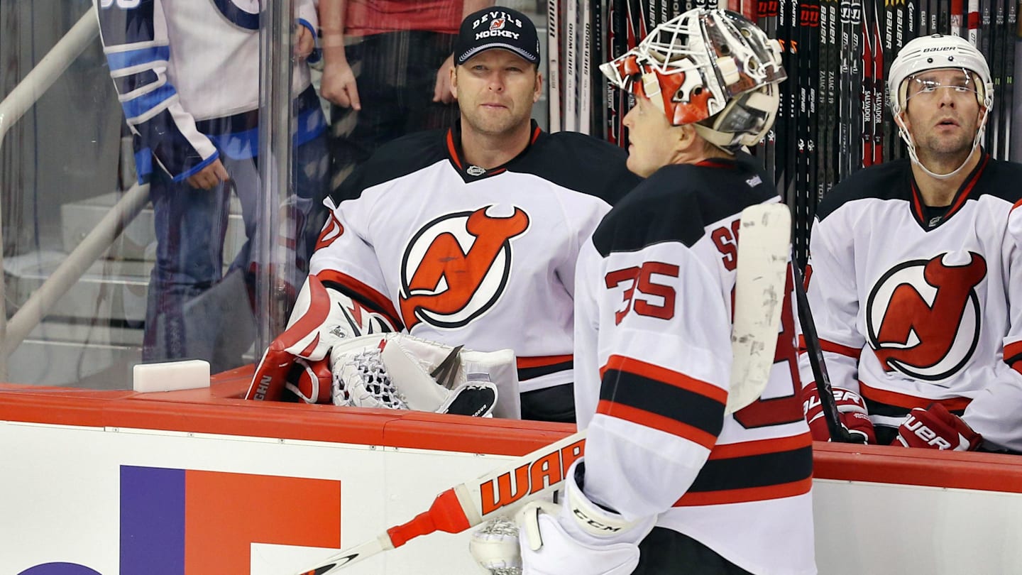 New Jersey Devils goalie Cory Schneider (35) speaks with goalie Martin Brodeur (30). Mandatory Credit: Bruce Fedyck-Imagn Images