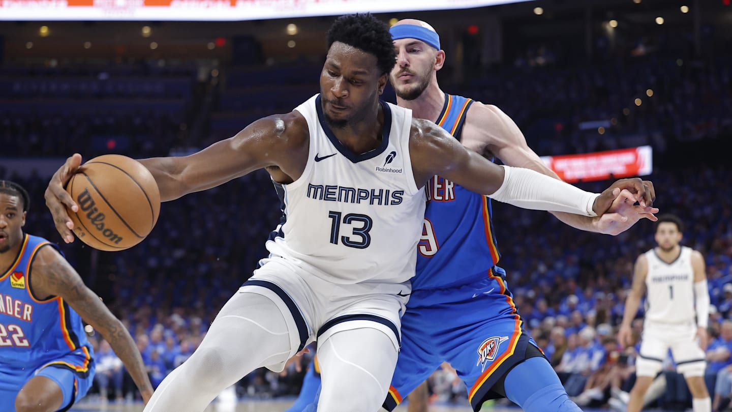 Apr 22, 2025; Oklahoma City, Oklahoma, USA; Memphis Grizzlies forward Jaren Jackson Jr. (13) moves the ball against Oklahoma City Thunder guard Alex Caruso (9) in the third quarter during game two of first round for the 2024 NBA Playoffs at Paycom Center. Mandatory Credit: Alonzo Adams-Imagn Images