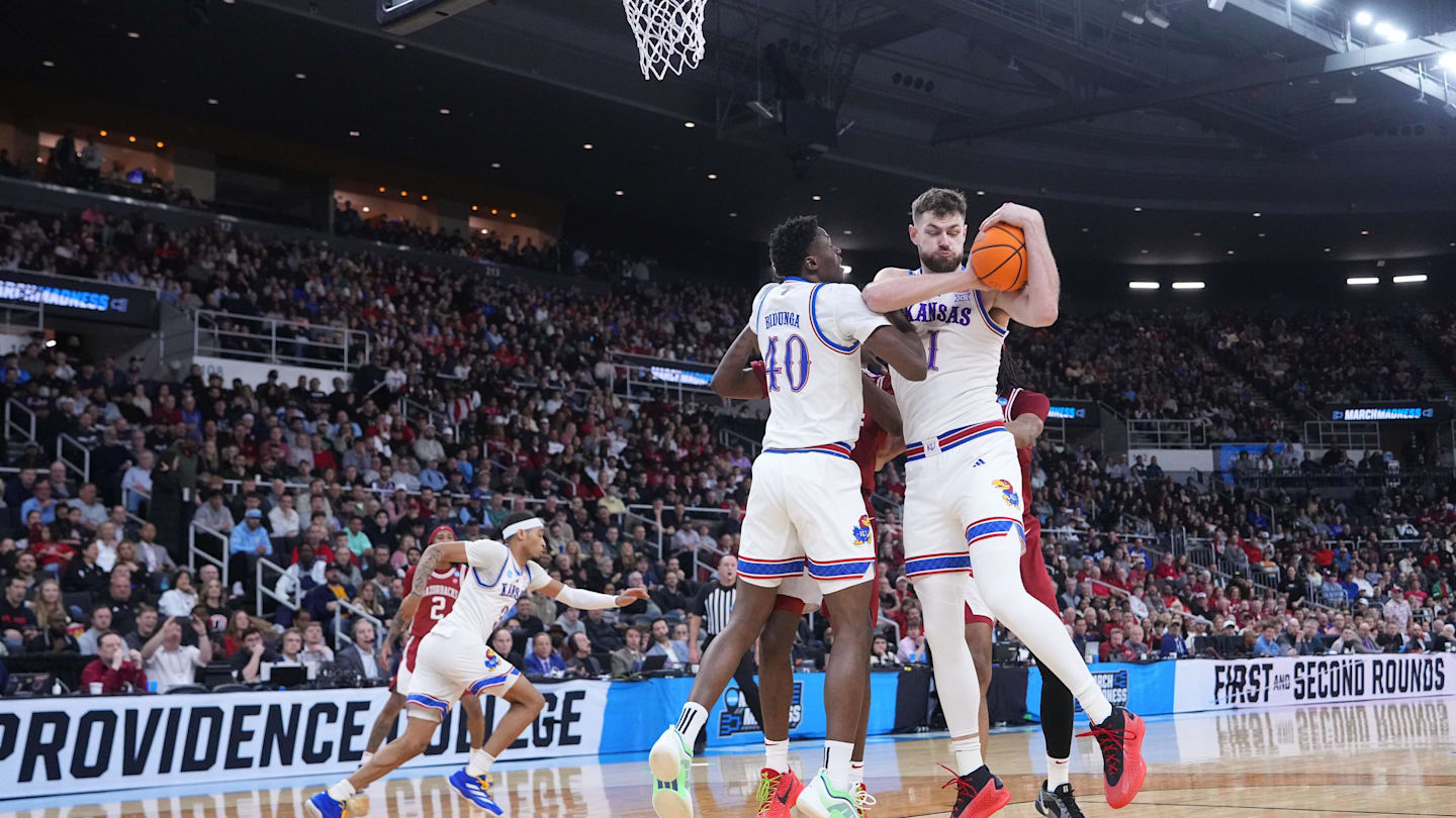 Mar 20, 2025; Providence, RI, USA;  Kansas Jayhawks center Hunter Dickinson (1) and forward Flory Bidunga (40) defend against Arkansas Razorbacks during the first half at Amica Mutual Pavilion. Mandatory Credit: Gregory Fisher-Imagn Images