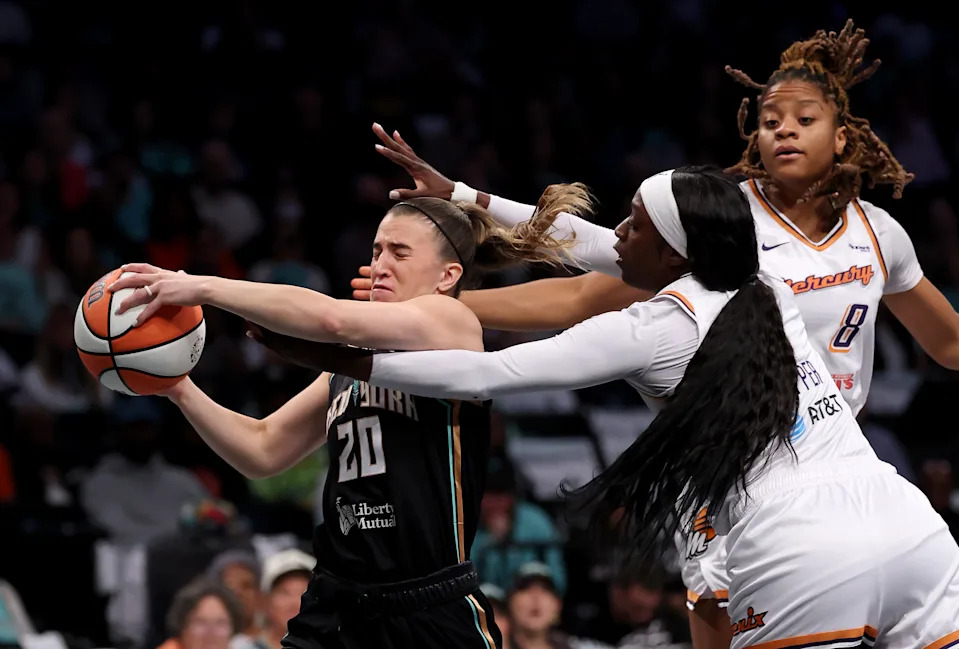 NEW YORK, NEW YORK - SEPTEMBER 17:  Sabrina Ionescu #20 of the New York Liberty tries to head for the net as Kahleah Copper #2 and Monique Akoa Makani #8 of the Phoenix Mercury defend in the first half during Game Two of the first round of the WNBA playoffs at Barclays Center on September 17, 2025 in the Brooklyn borough of New York City. NOTE TO USER: User expressly acknowledges and agrees that, by downloading and or using this photograph, User is consenting to the terms and conditions of the Getty Images License Agreement. (Photo by Elsa/Getty Images)