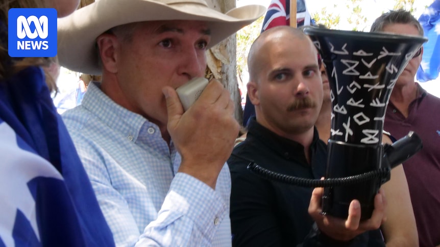 KAP leader says he was unaware man next to him at rally was wearing  neo-Nazi insignia
