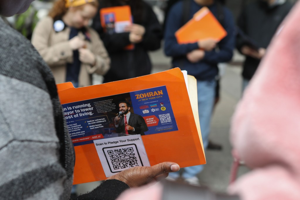Zohran Mamdani canvassers prepare to speak with voters on the Upper East Side.