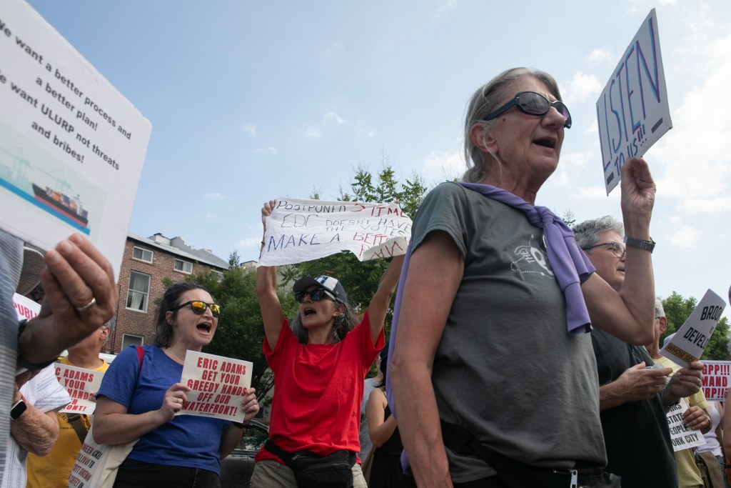 People opposed to the Brooklyn Marine Terminal redevelopment rally across from the port’s northern side after a vote on the plan was delayed.