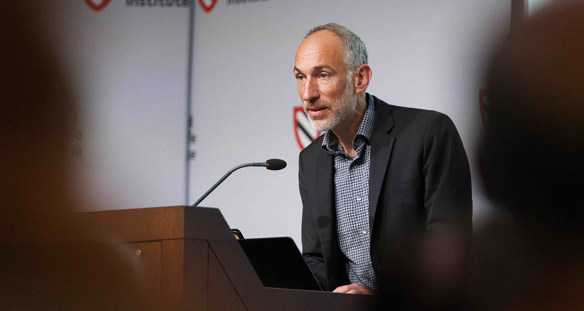 David Reich at lectern.