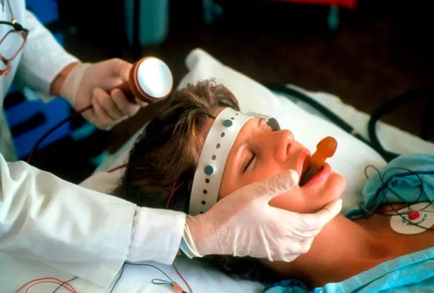 A patient being prepared for electroconvulsive treatment