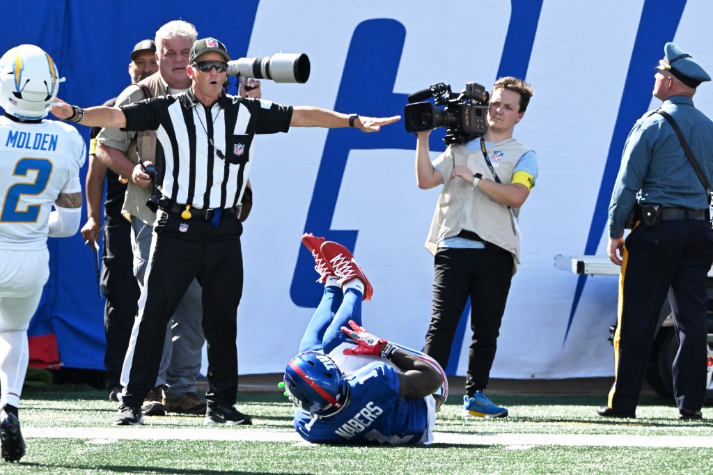 Giants wide receiver Malik Nabers (1) is injured during a game.