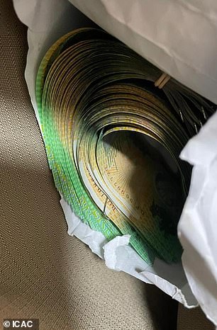 Police seized cash worth more than $12,000 when they raided the Helmy's Merrylands home
