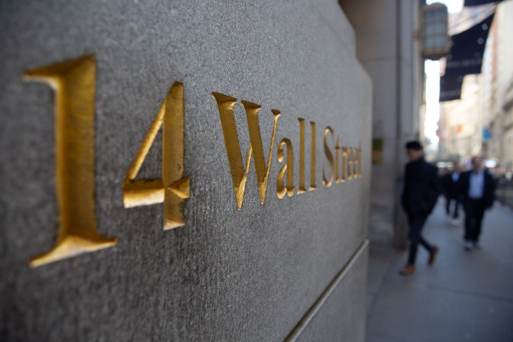 Workers walked into 14 Wall St. near the Stock Exchange.