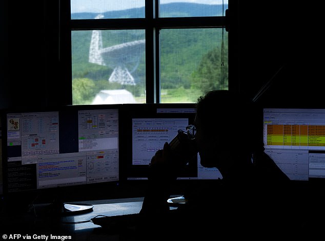 Observatory engineers and experts concluded that the best compromise - for the benefit of the local community - was to officially permit limited use of 2.4 GHz Wi-Fi, since the band was already compromised by some unregulated signals in the area (pictured: telescope operator in control room)